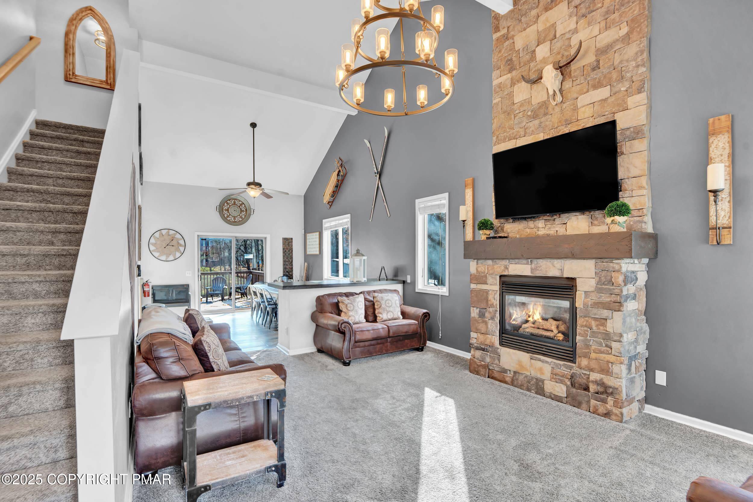 112 Maccauley Road Albrightsville, PA 18210 - Photo 15 of 76 a living room with furniture a flat screen tv and a fireplace