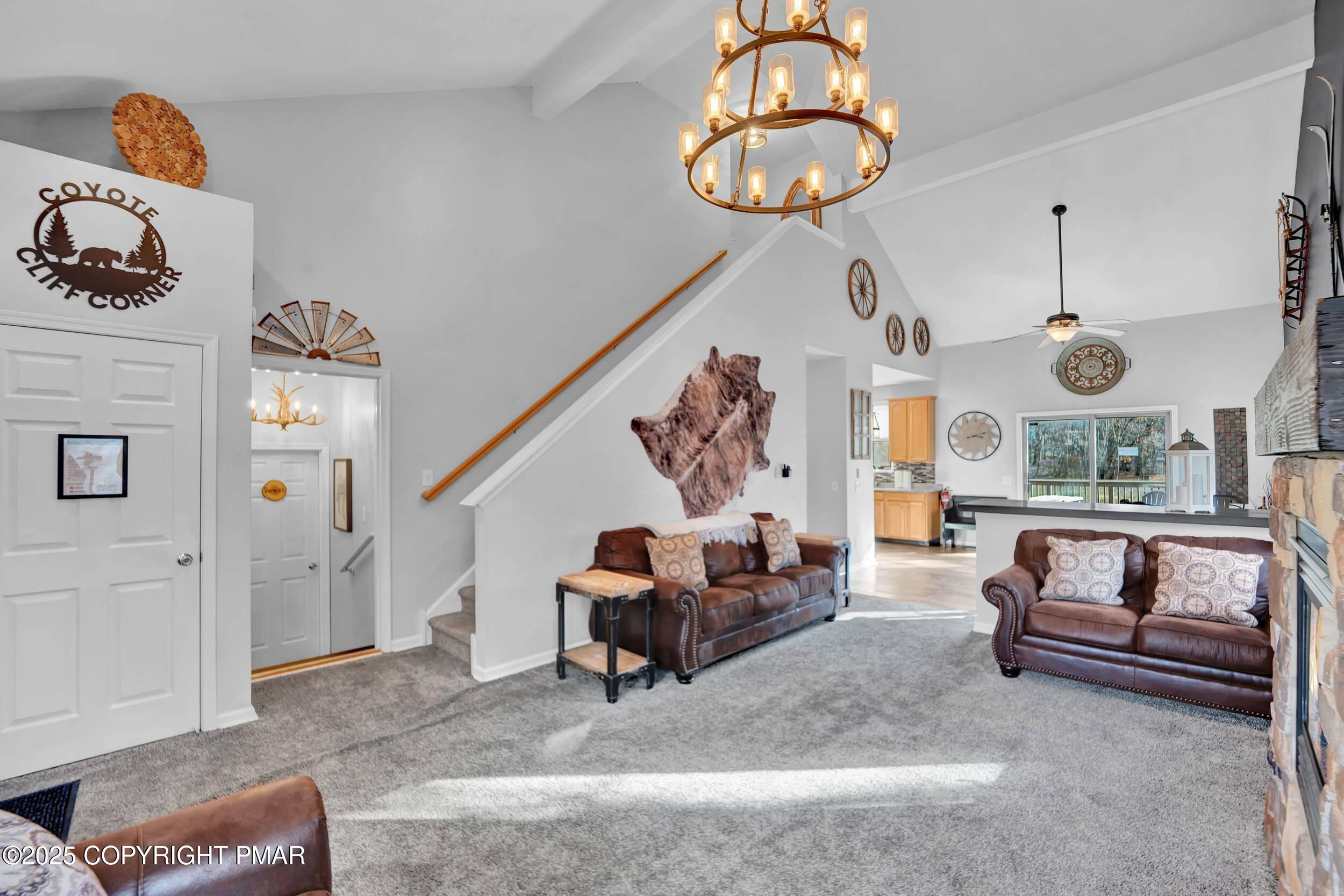 112 Maccauley Road Albrightsville, PA 18210 - Photo 17 of 76 a living room with furniture and a chandelier
