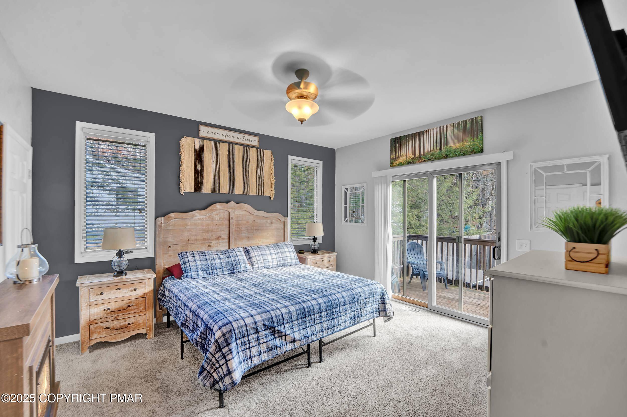 112 Maccauley Road Albrightsville, PA 18210 - Photo 18 of 76 a bedroom with a large bed and a chandelier