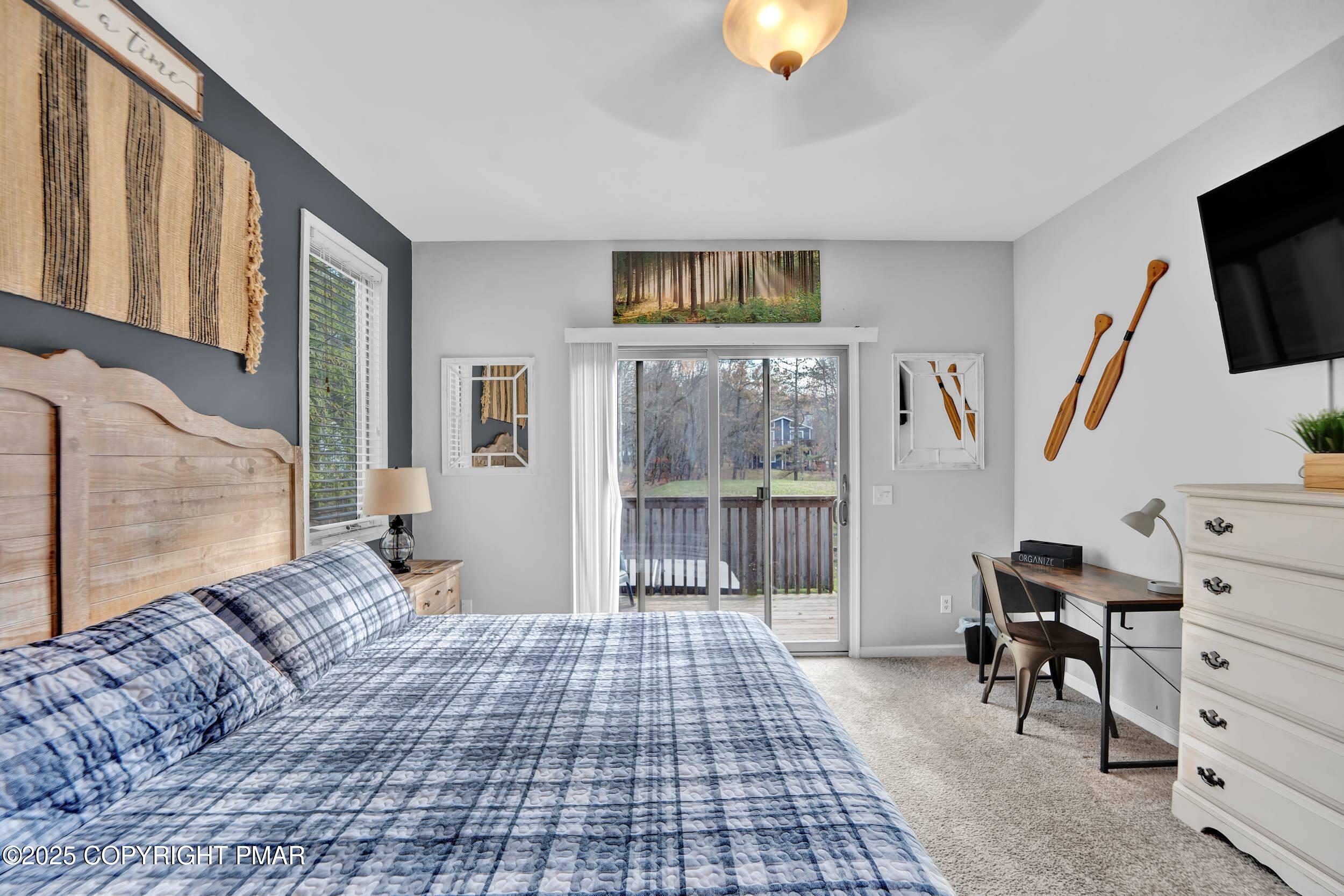 112 Maccauley Road Albrightsville, PA 18210 - Photo 19 of 76 a bedroom with furniture and a flat screen tv