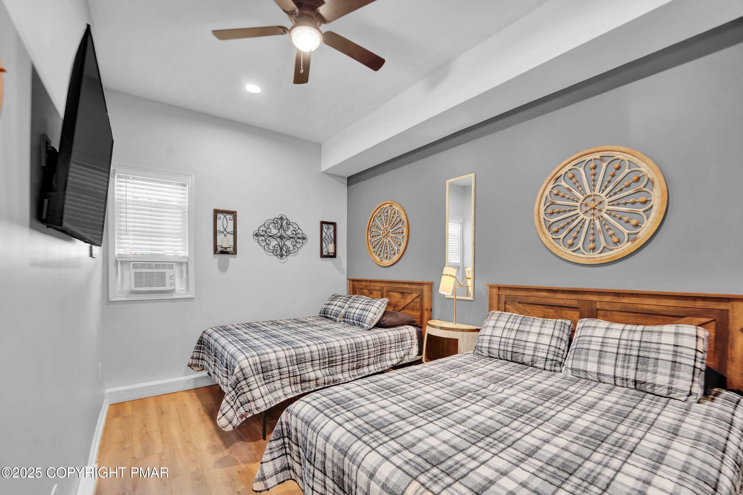 112 Maccauley Road Albrightsville, PA 18210 - Photo 27 of 76 a bedroom with a bed and a chandelier