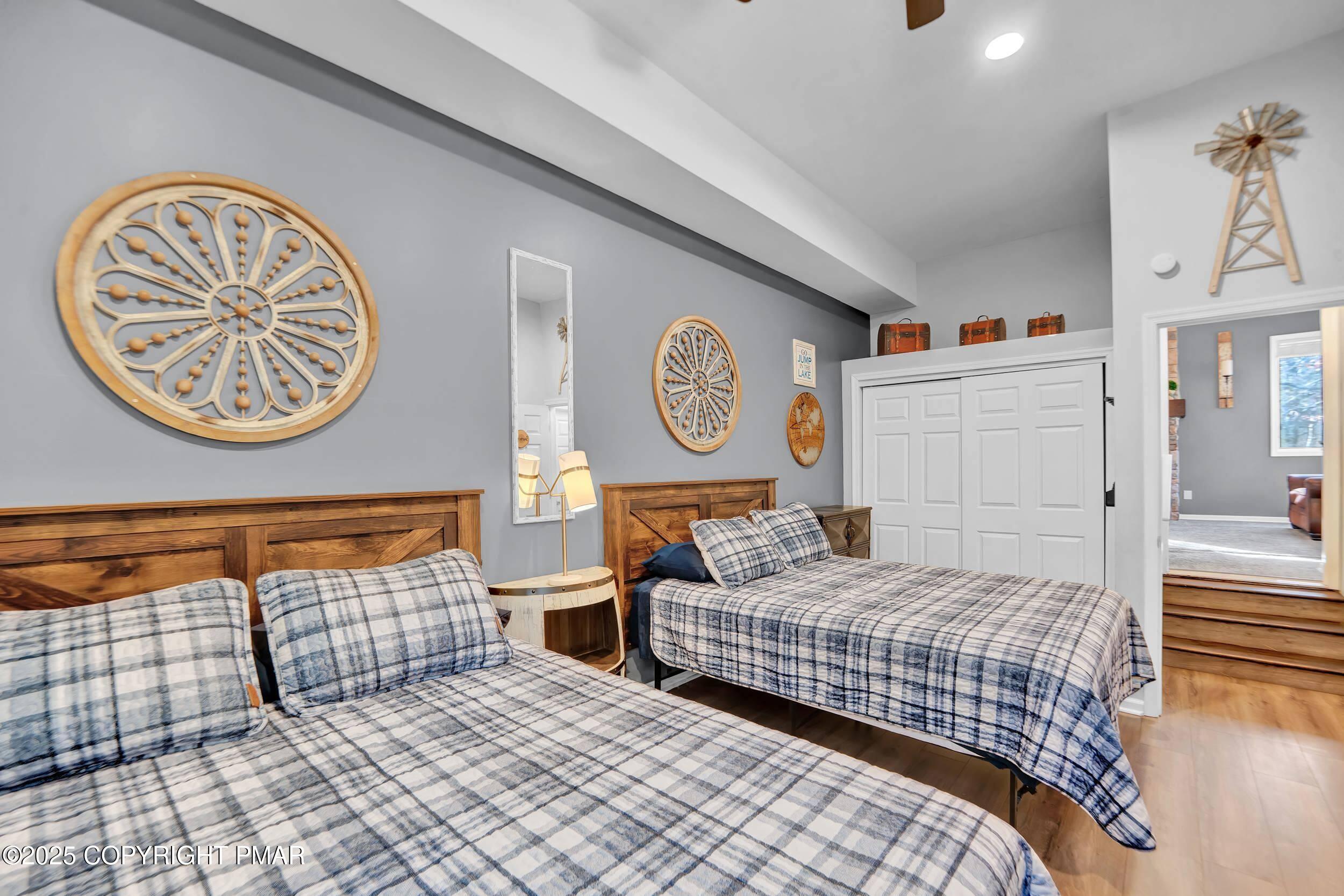 112 Maccauley Road Albrightsville, PA 18210 - Photo 28 of 76 a bedroom with a bed and a lamp on dresser