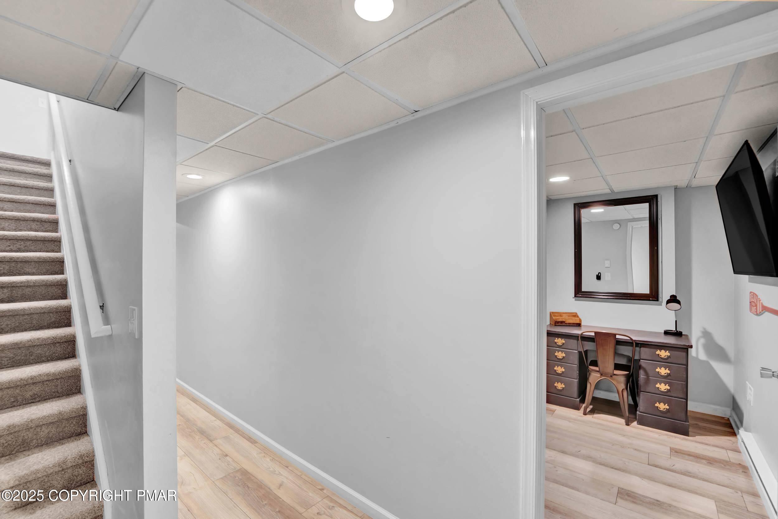 112 Maccauley Road Albrightsville, PA 18210 - Photo 29 of 76 a view of a hallway with wooden floor and staircase