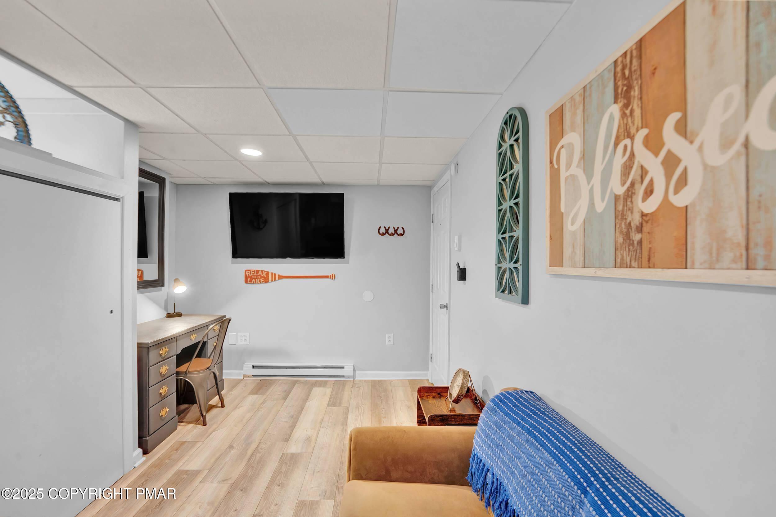 112 Maccauley Road Albrightsville, PA 18210 - Photo 33 of 76 a living room with furniture and a flat screen tv