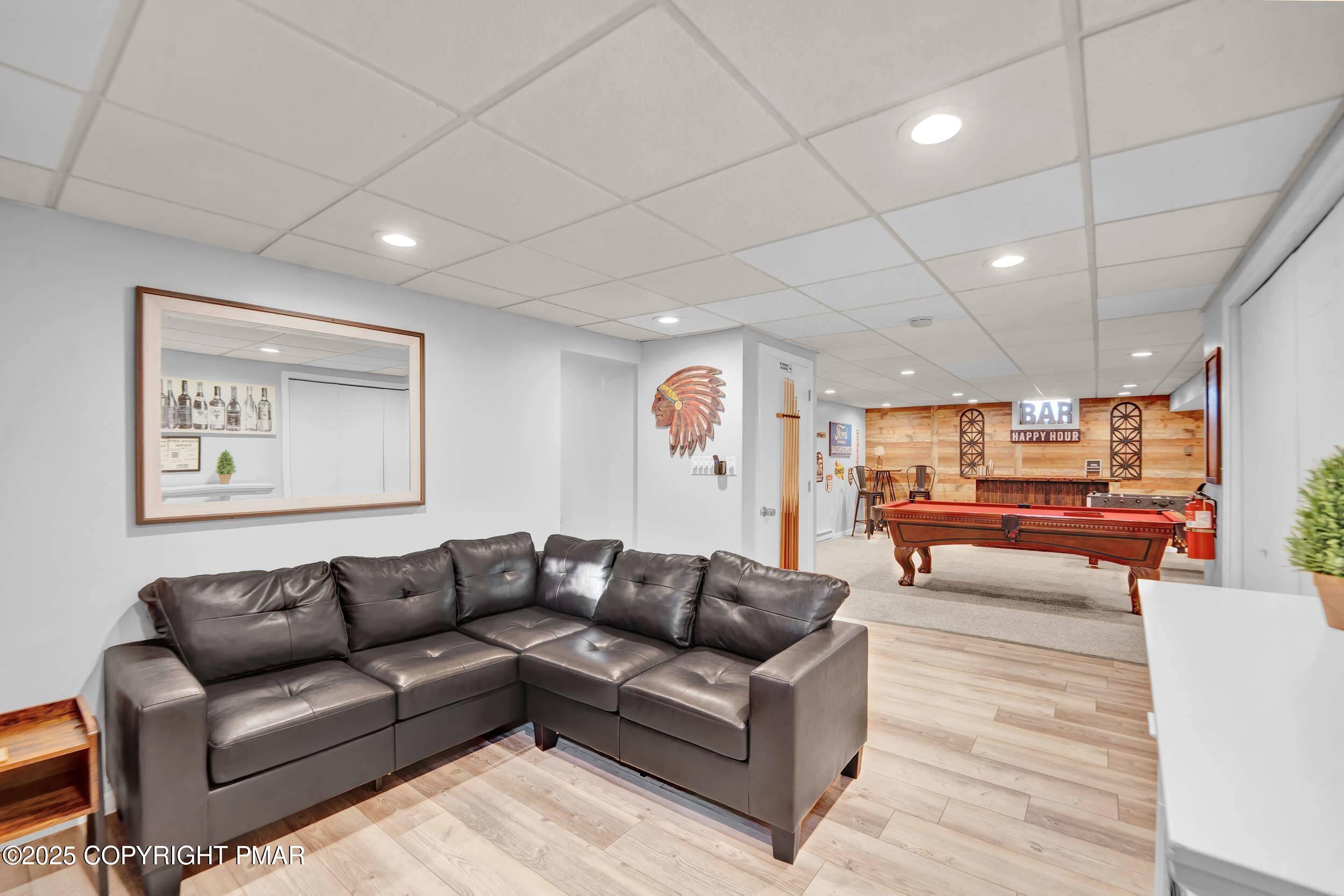 112 Maccauley Road Albrightsville, PA 18210 - Photo 35 of 76 a living room with furniture and a wooden floor