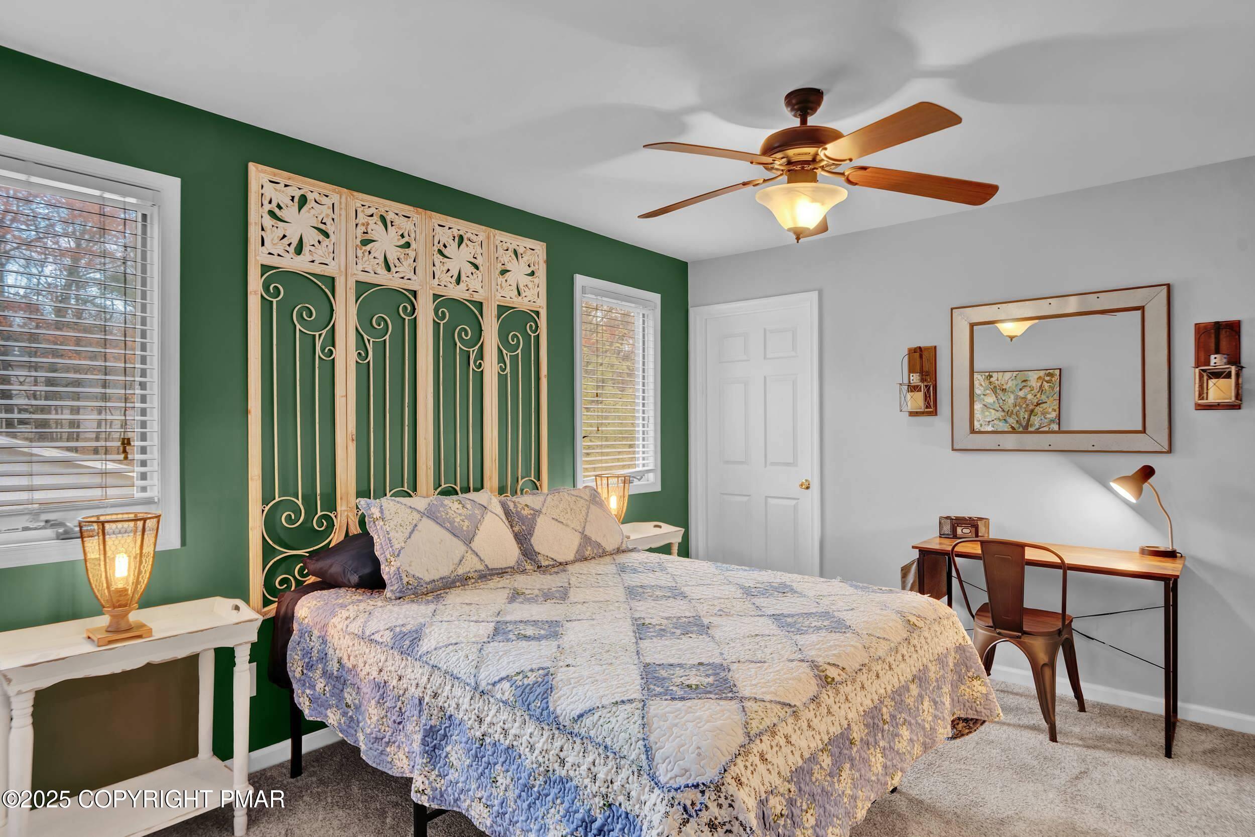 112 Maccauley Road Albrightsville, PA 18210 - Photo 43 of 76 a bedroom with a bed and a chandelier