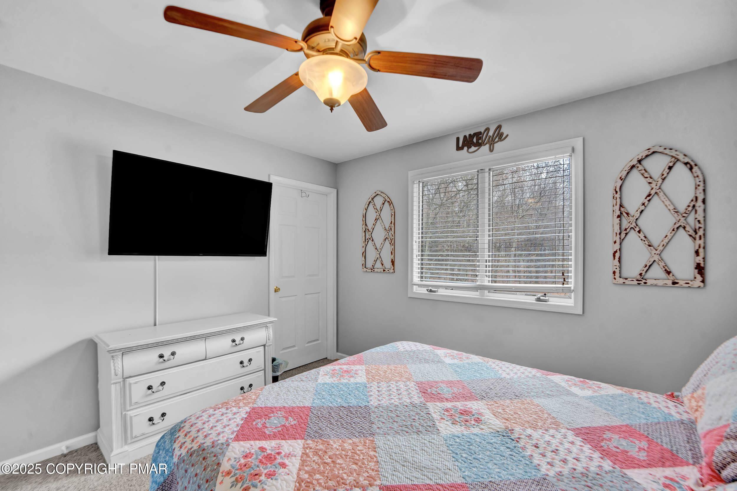 112 Maccauley Road Albrightsville, PA 18210 - Photo 46 of 76 a bedroom with a bed and a flat screen tv