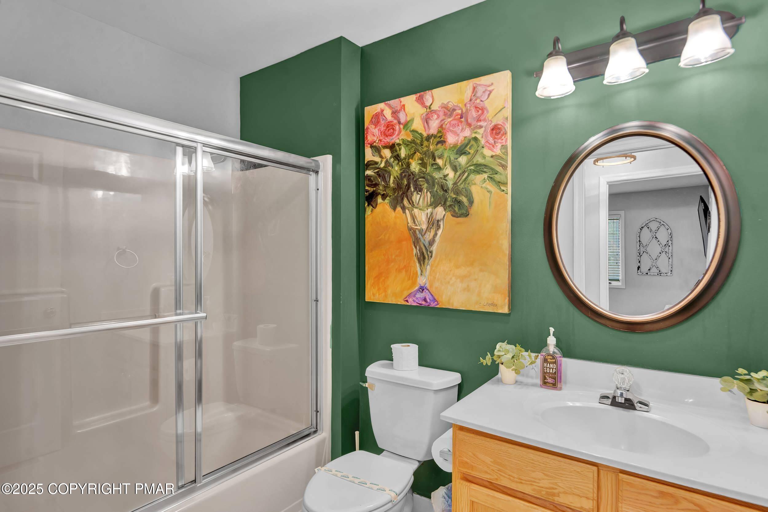 112 Maccauley Road Albrightsville, PA 18210 - Photo 47 of 76 a bathroom with a toilet sink and mirror