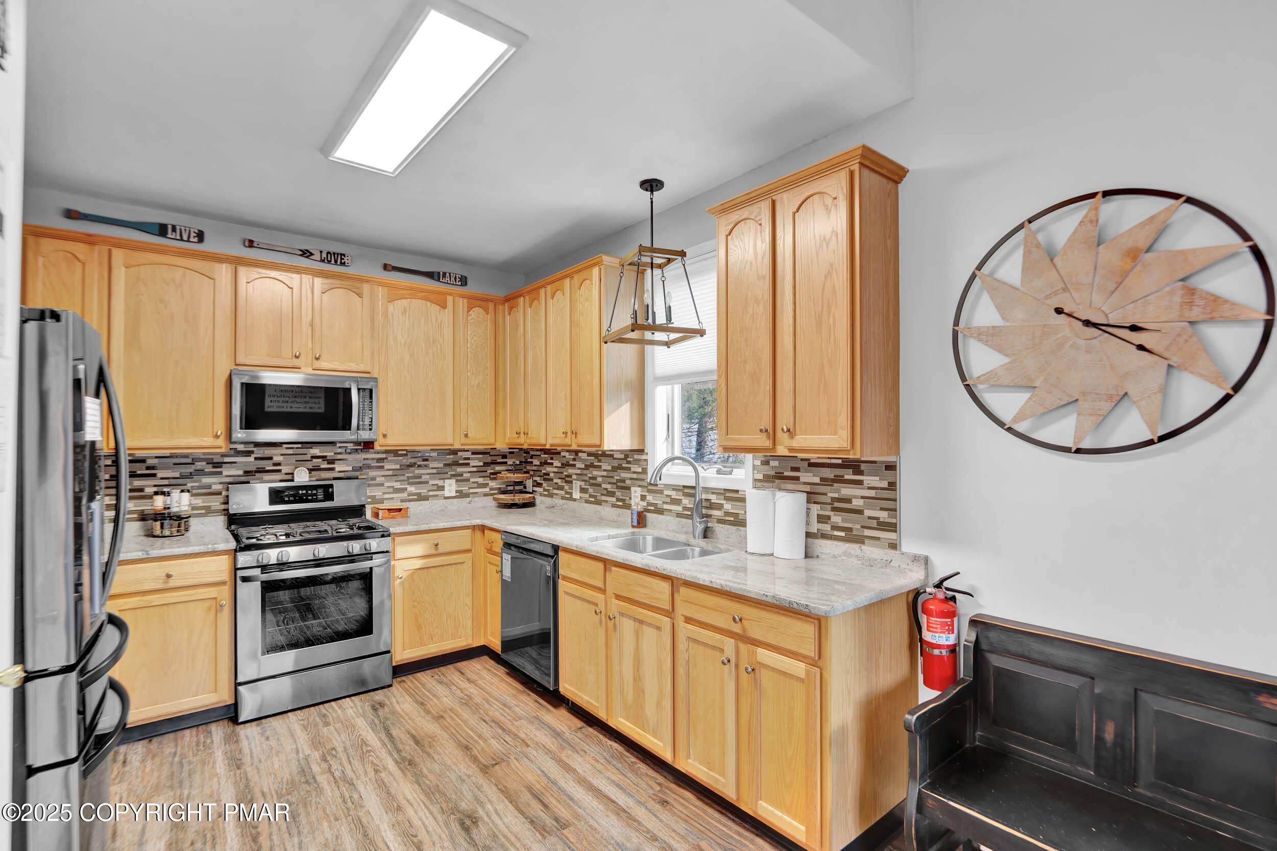 112 Maccauley Road Albrightsville, PA 18210 - Photo 6 of 76 a kitchen with stainless steel appliances granite countertop a stove and a sink