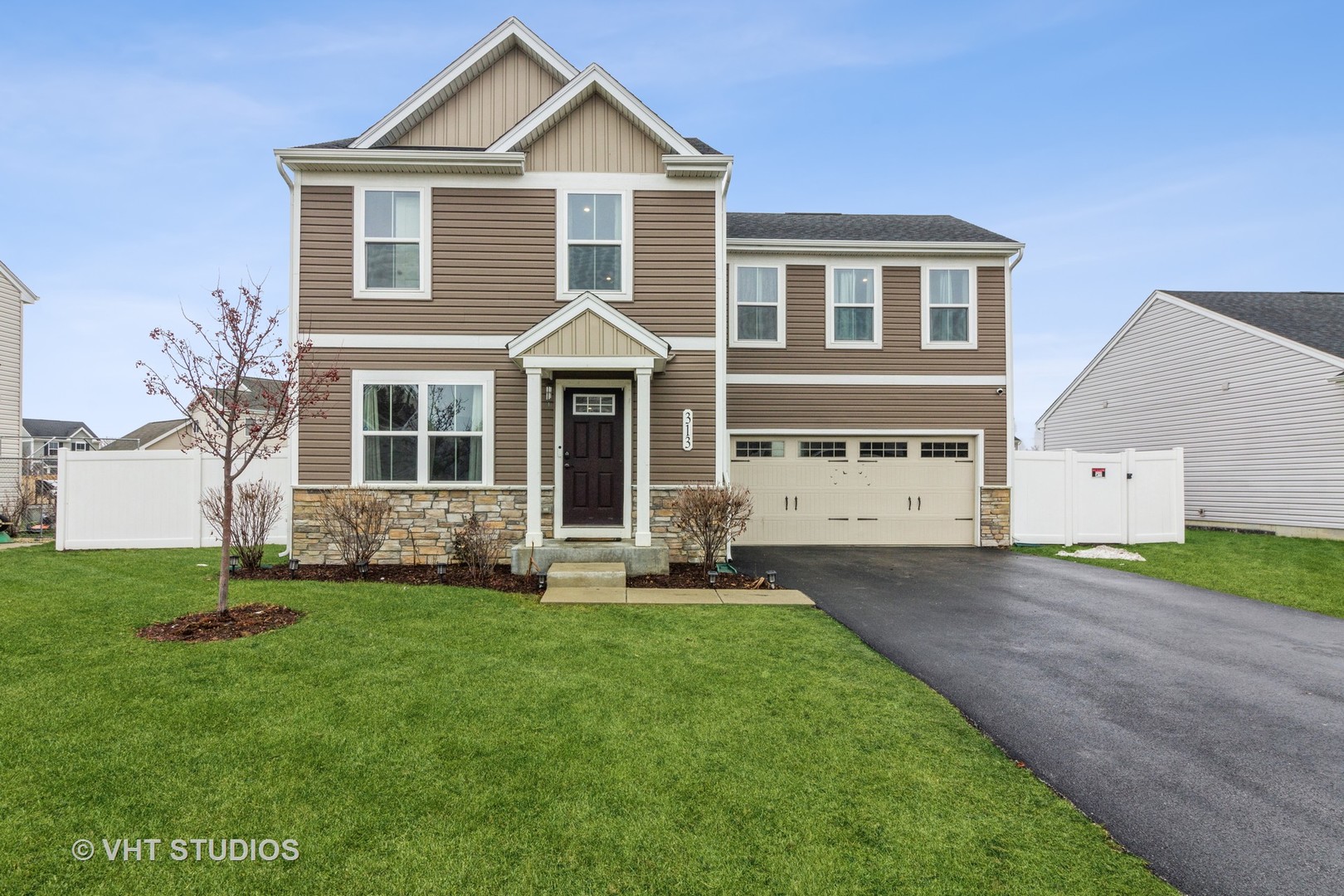 a front view of a house with a yard