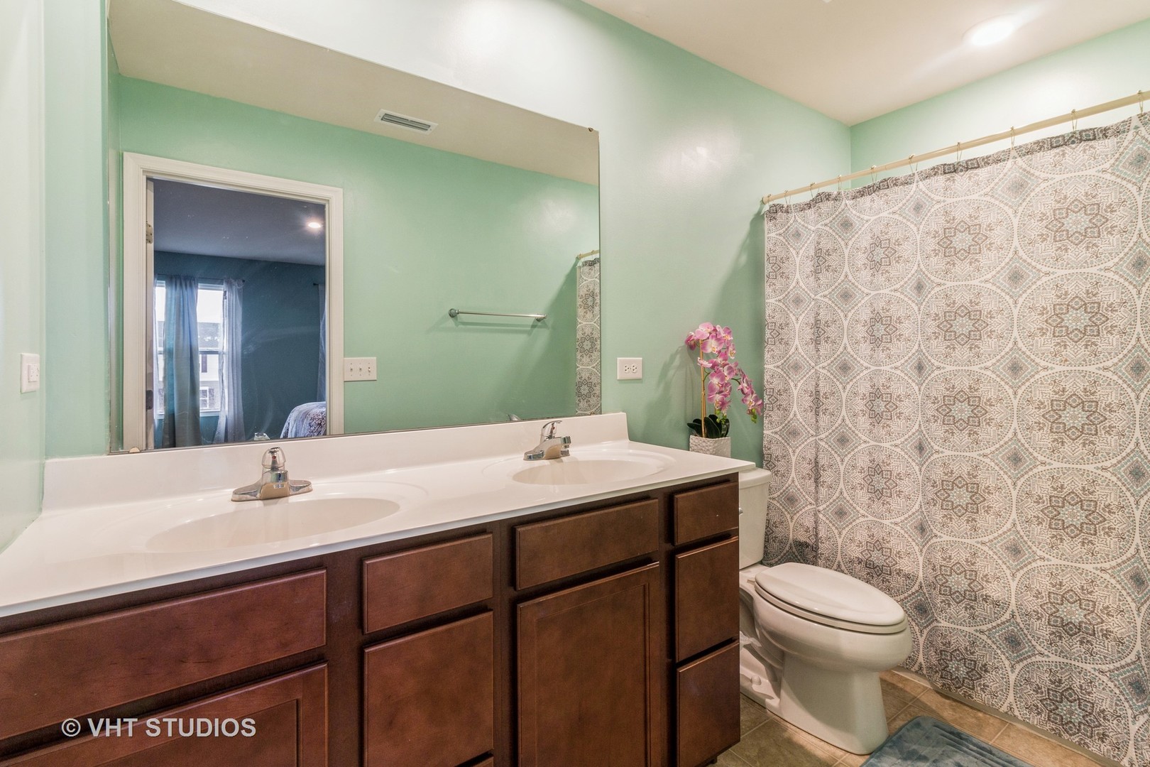 313 Pheasant Run Road Joliet, IL 60433 - Photo 12 of 24 a bathroom with a sink toilet and shower