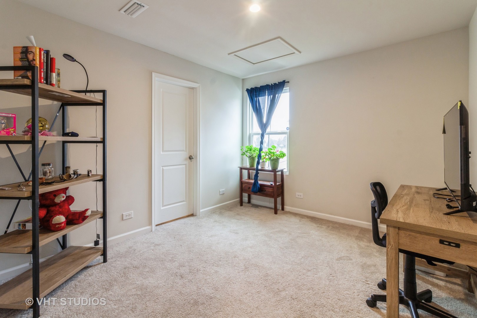 313 Pheasant Run Road Joliet, IL 60433 - Photo 16 of 24 a view of a workspace with furniture and a window