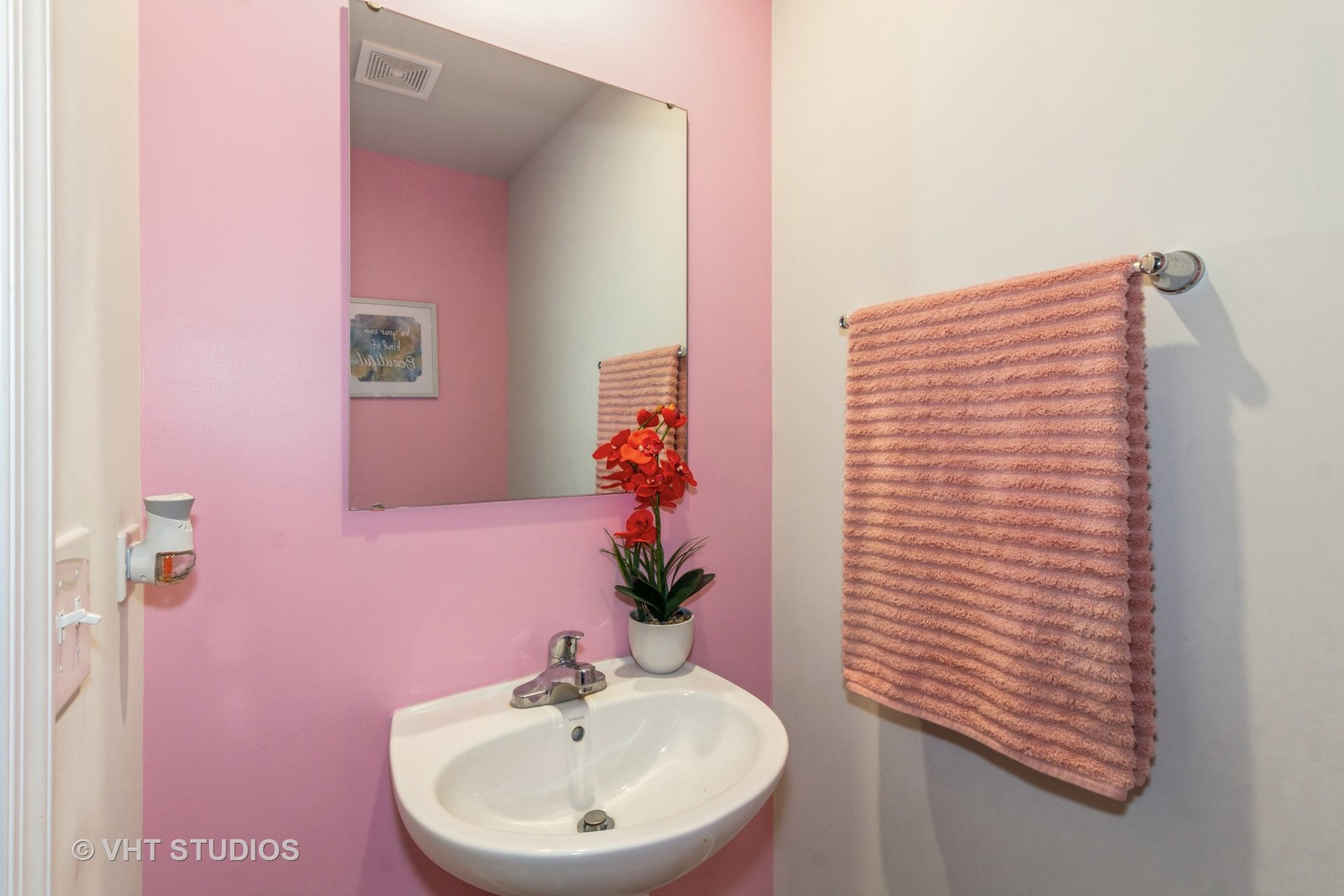 313 Pheasant Run Road Joliet, IL 60433 - Photo 9 of 24 a bathroom with a sink a mirror and a potted plant