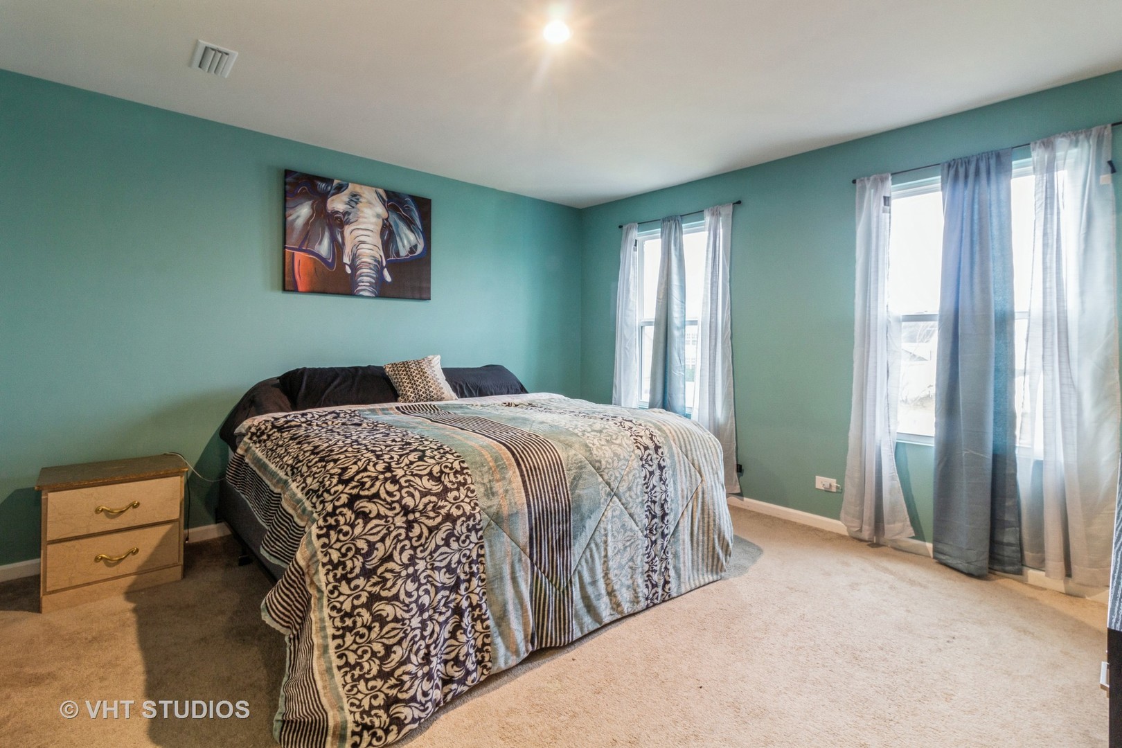 313 Pheasant Run Road Joliet, IL 60433 - Photo 10 of 24 a bedroom with a large bed and a window