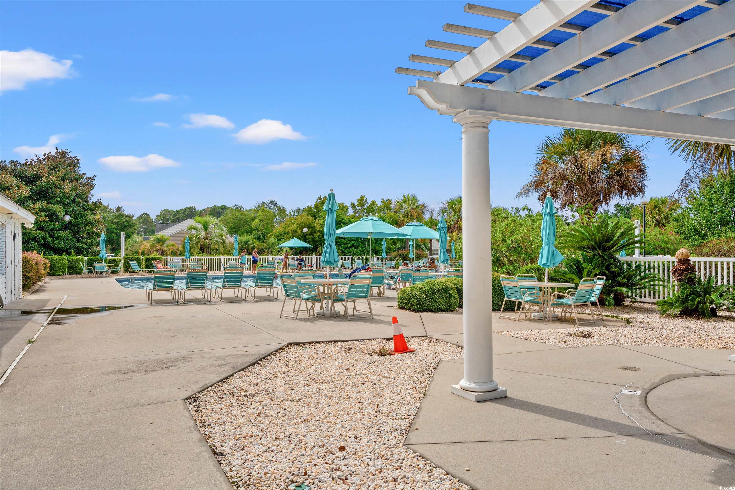 168 Wimbledon Way, Unit 168 Murrells Inlet, SC 29576 - Photo 25 of 27 View of patio / terrace with a community pool