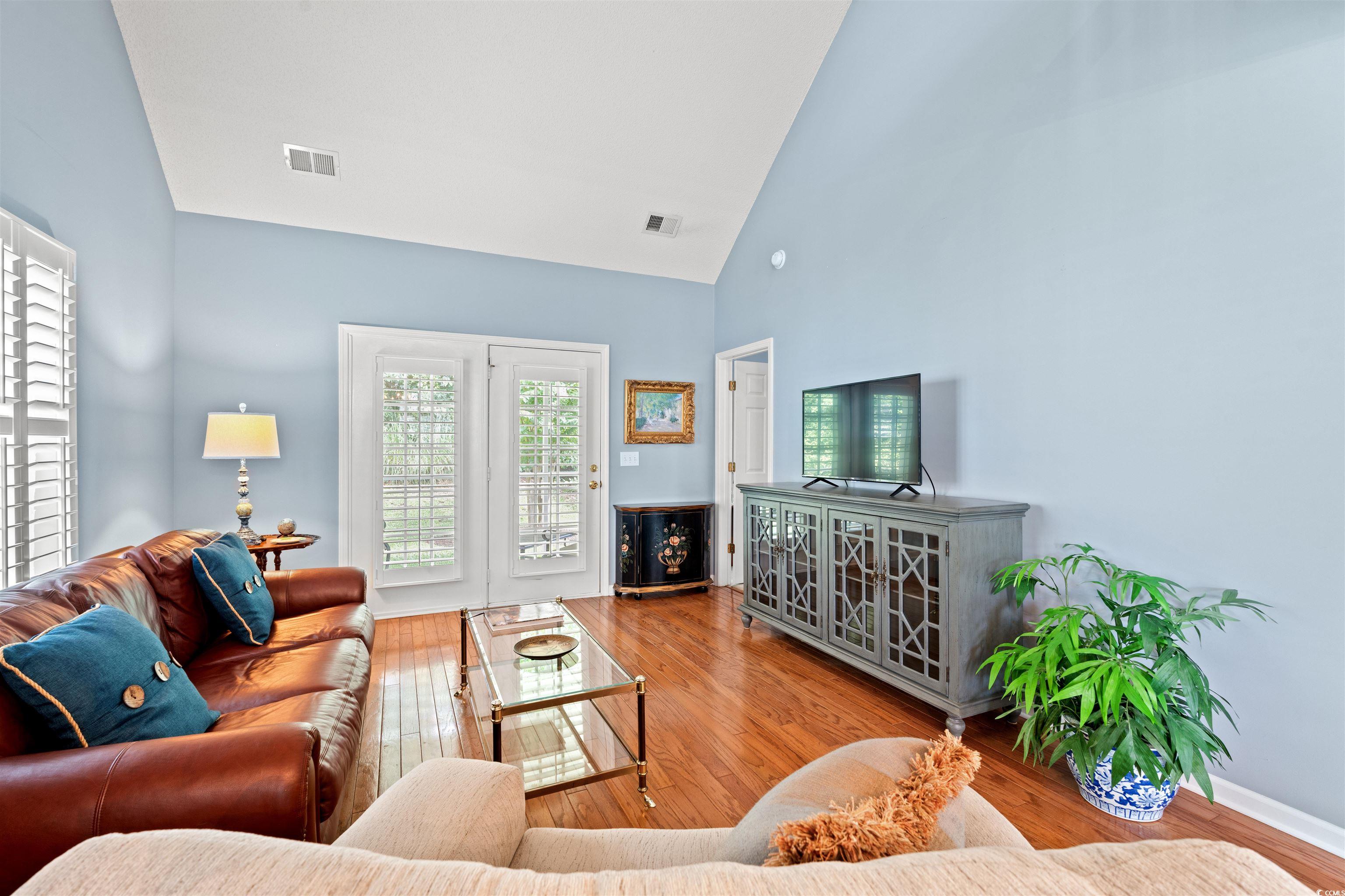 168 Wimbledon Way, Unit 168 Murrells Inlet, SC 29576 - Photo 5 of 27 Living area featuring high vaulted ceiling and light wood-style floors
