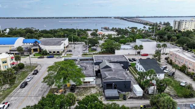 an aerial view of a house with a swimming pool yard and outdoor seating