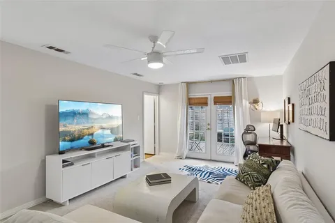 a living room with furniture and a large window