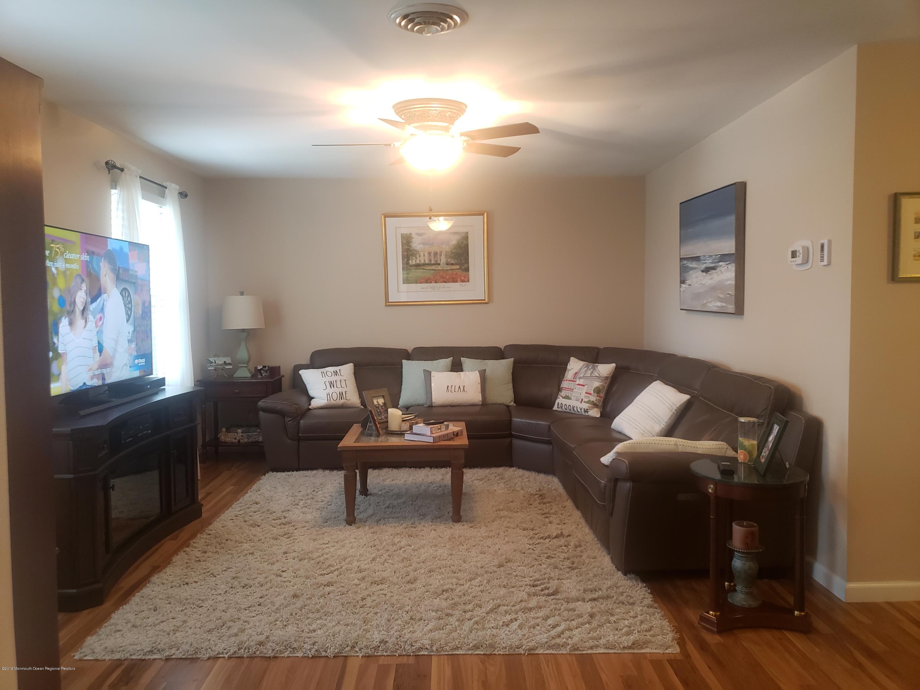 33 Mill Road, Unit 64 Whiting, NJ 08759 - Photo 13 of 23 a living room with furniture and wooden floor