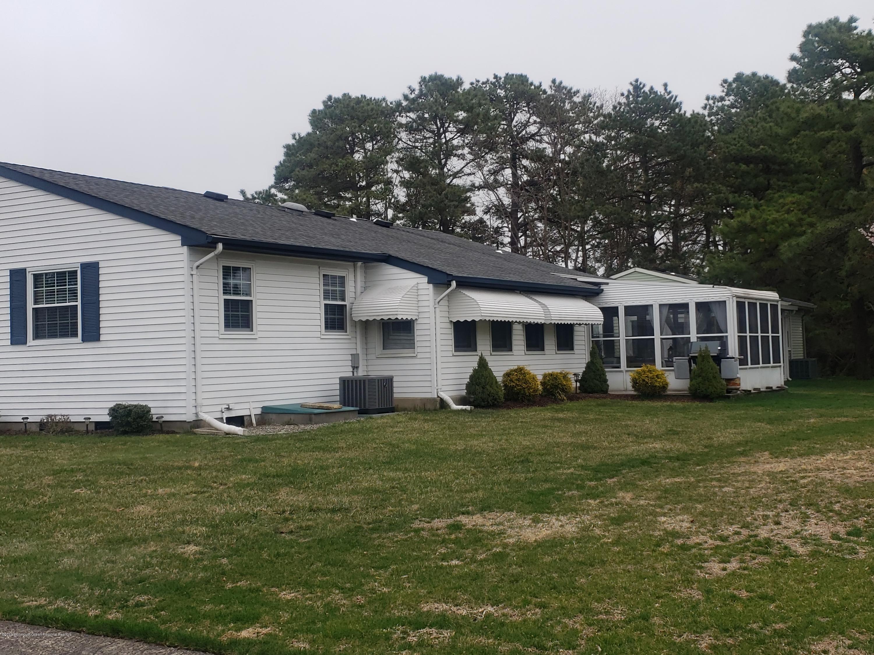 33 Mill Road, Unit 64 Whiting, NJ 08759 - Photo 23 of 23 a front view of a house with a garden