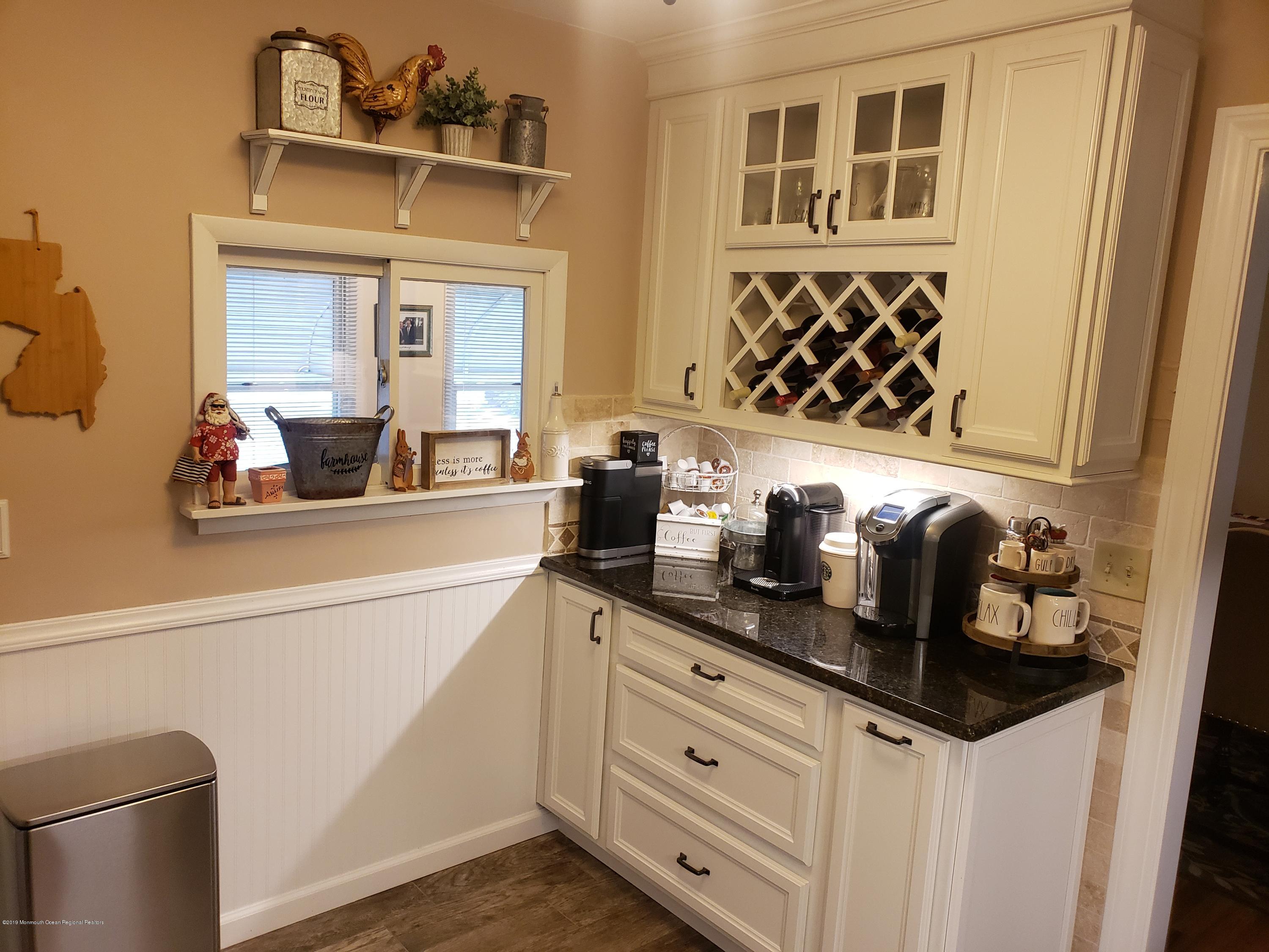 33 Mill Road, Unit 64 Whiting, NJ 08759 - Photo 3 of 23 a kitchen with a sink and cabinets