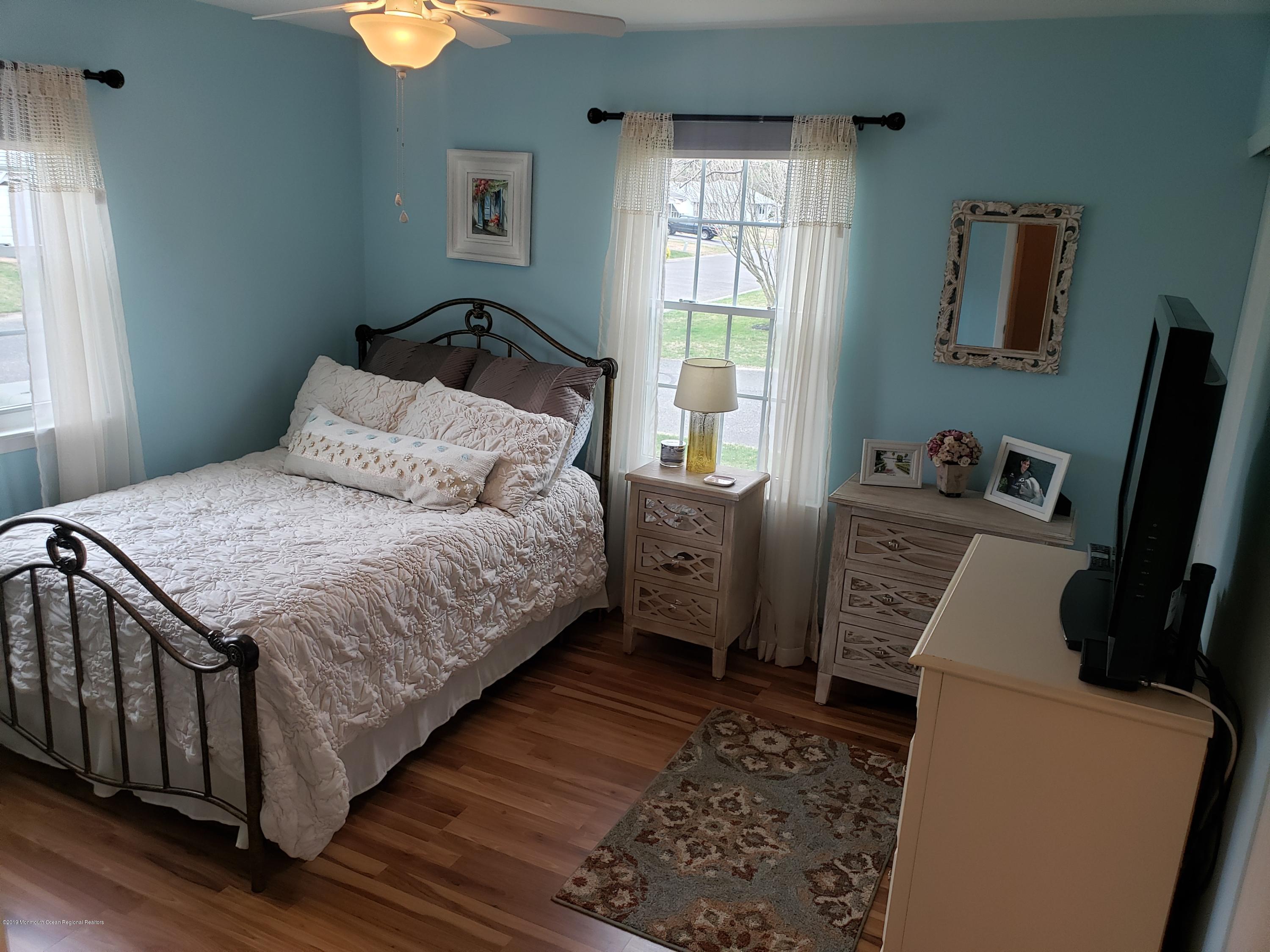 33 Mill Road, Unit 64 Whiting, NJ 08759 - Photo 7 of 23 a bedroom with a bed and a window