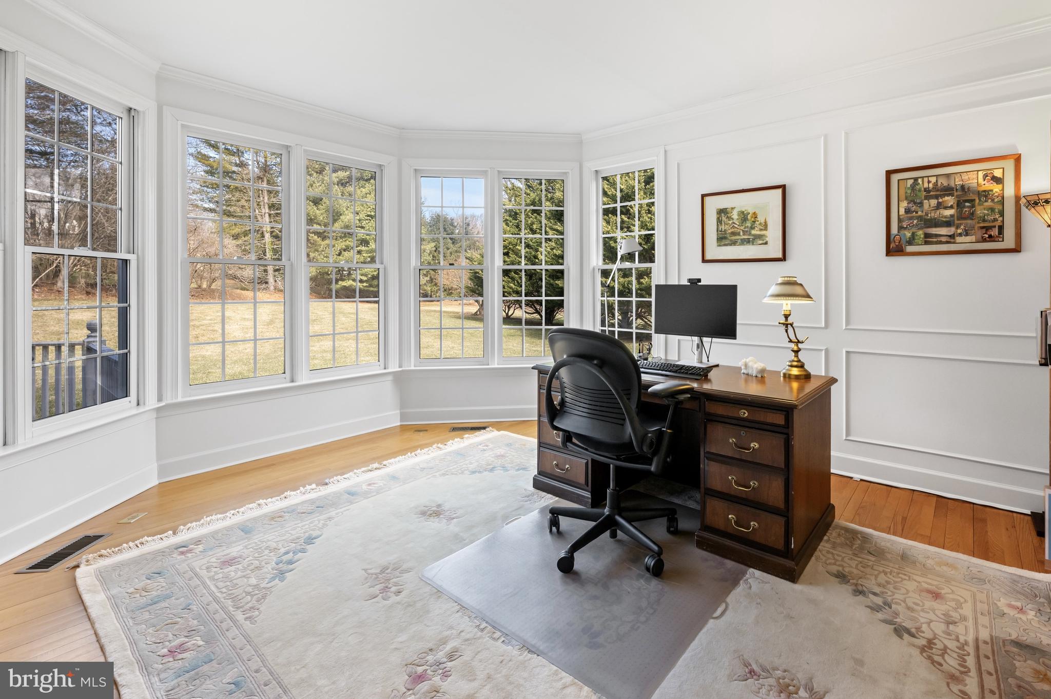 9420 Crimson Leaf Terrace Potomac, MD 20854 - Photo 12 of 33 a view of a workspace with furniture and a window