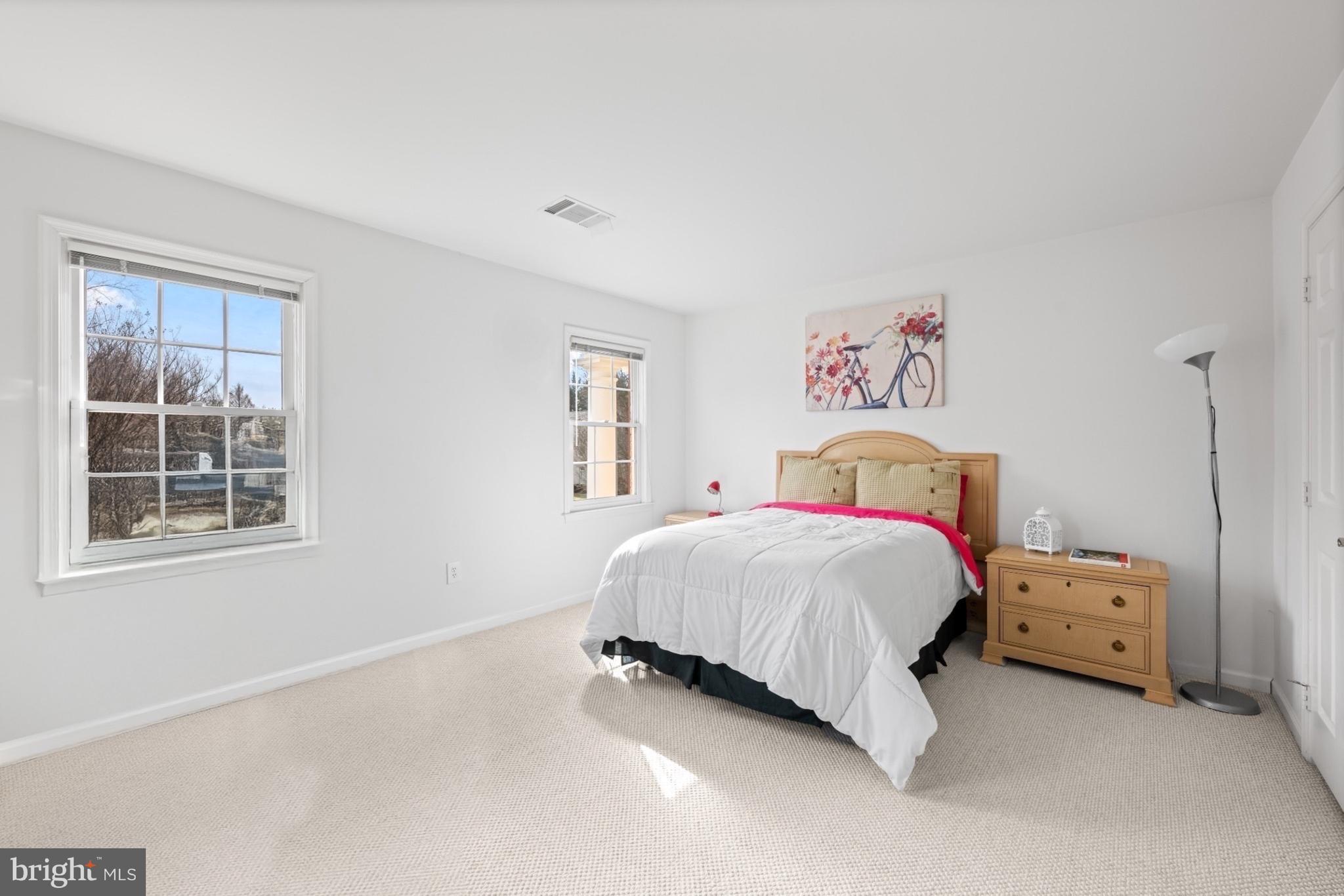 9420 Crimson Leaf Terrace Potomac, MD 20854 - Photo 19 of 33 a bedroom with a bed and a window