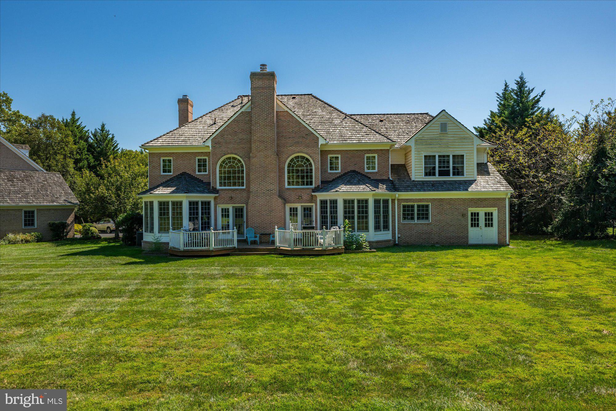 9420 Crimson Leaf Terrace Potomac, MD 20854 - Photo 26 of 33 a front view of a house with a garden