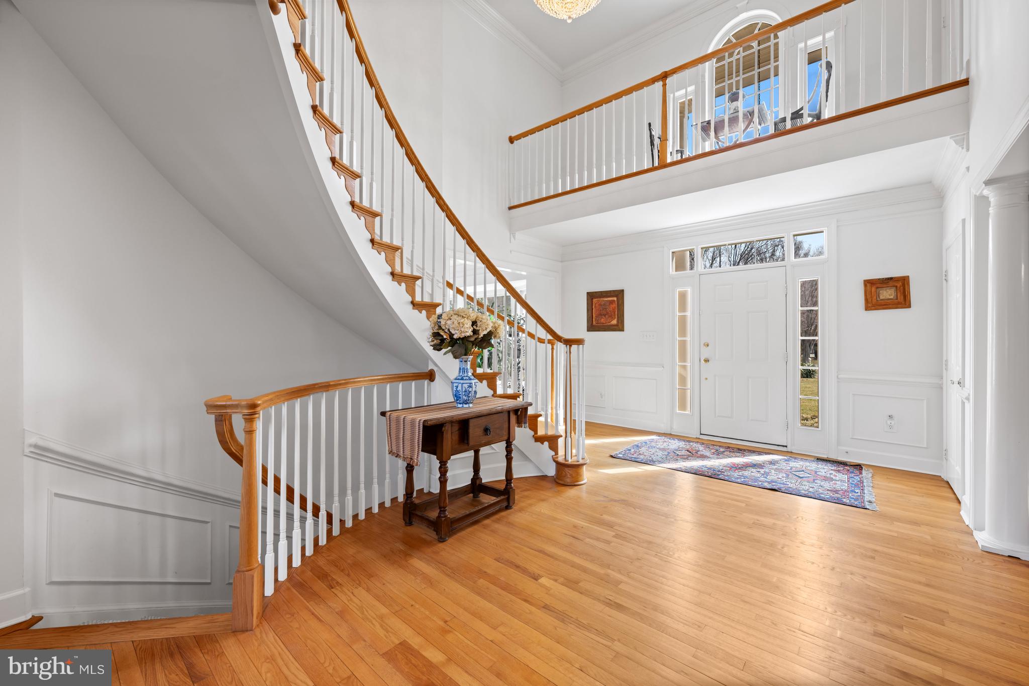 9420 Crimson Leaf Terrace Potomac, MD 20854 - Photo 4 of 33 a view of entryway and hall with wooden floor