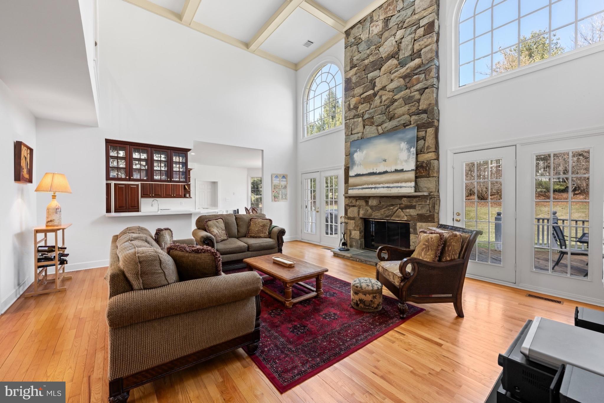 9420 Crimson Leaf Terrace Potomac, MD 20854 - Photo 6 of 33 a living room with furniture fireplace and wooden floor