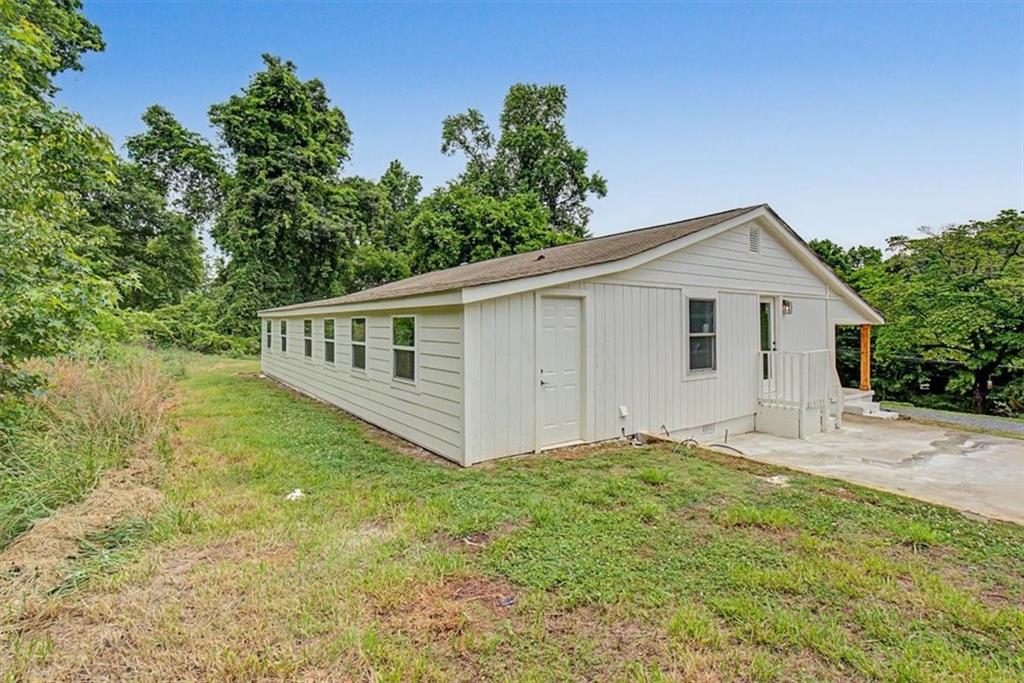 2115 King Road Dalton, GA 30720 - Photo 35 of 54 a view of a house with a yard