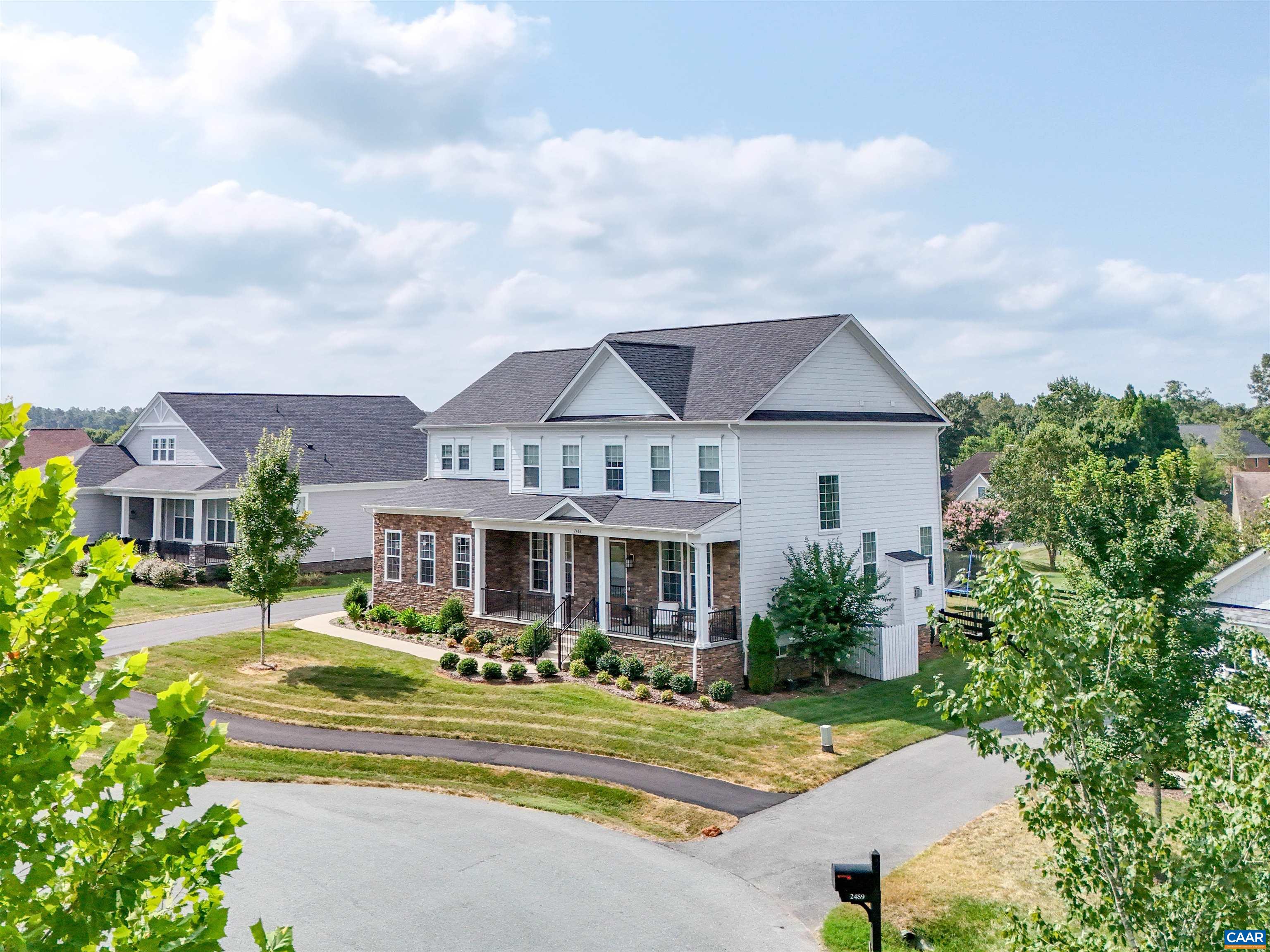 2483 Ferndown Lane Keswick, VA 22947 - Photo 2 of 54 a front view of a house with a garden