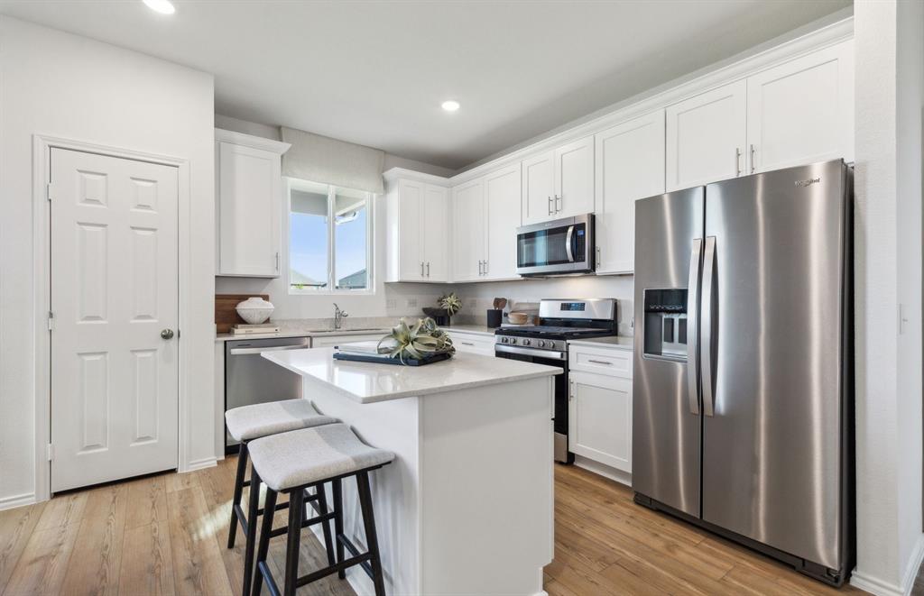 7505 Bent Gale Road Pilot Point, TX 76258 - Photo 7 of 21 *Model Representation - Spacious kitchen with eat-in bartop island