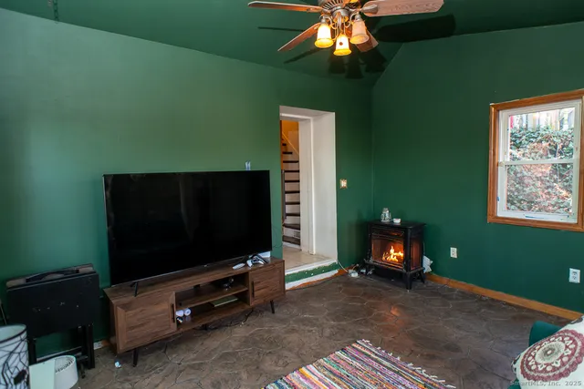 a living room with furniture and a flat screen tv