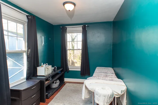 a dining room with furniture and window
