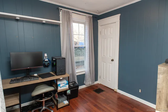 a workspace with furniture and lamp