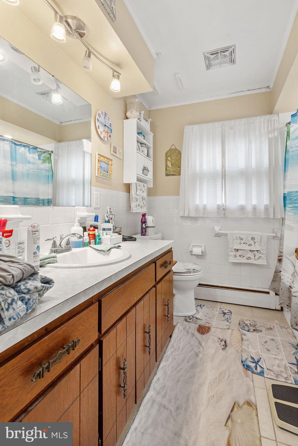 150 Sherman Street Hanover, PA 17331 - Photo 14 of 24 a bathroom with a sink double vanity and a bathtub