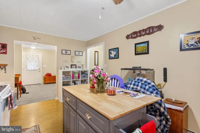 a view of a dining room with furniture and a chandelier
