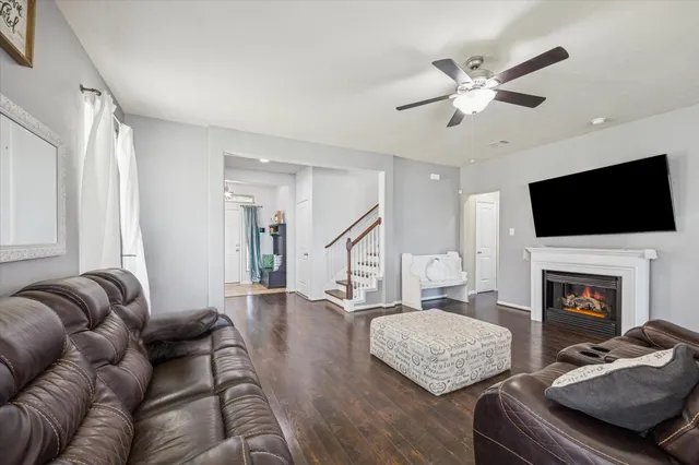 a living room with furniture fireplace and flat screen tv