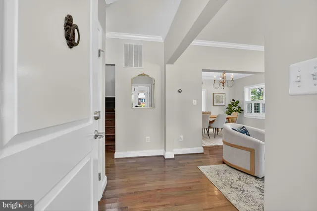a kitchen with kitchen island granite countertop a sink a counter space appliances and cabinets