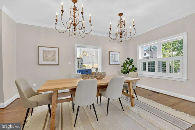a living room with furniture a rug and a lamp