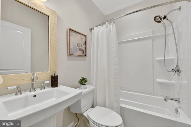 a kitchen with stainless steel appliances granite countertop a stove a sink a microwave a dining table and chairs with wooden floor