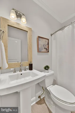 a kitchen with kitchen island granite countertop a stove and a wooden floors