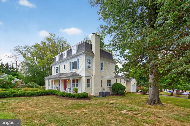 a living room with furniture a rug and a fireplace