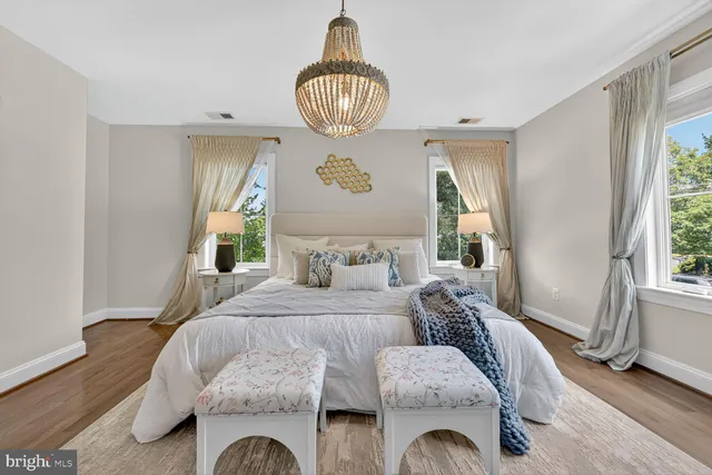 a bathroom with a granite countertop toilet sink and a mirror