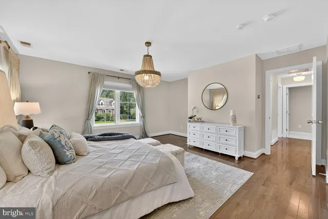 a living room with furniture a rug and a window