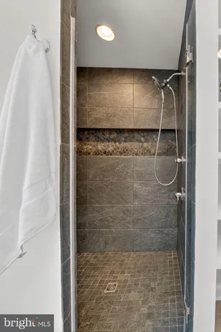 a view of a house with backyard sitting area and garden