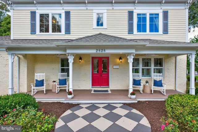 a living room with a painting on the wall and a fireplace