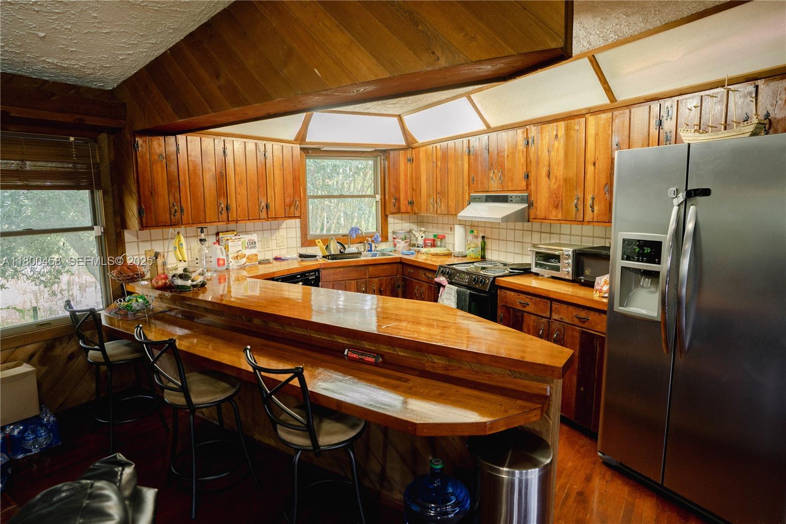 North Okeechobee Okeechobee, FL 34972 - Photo 11 of 23 a kitchen with a table chairs sink and cabinets